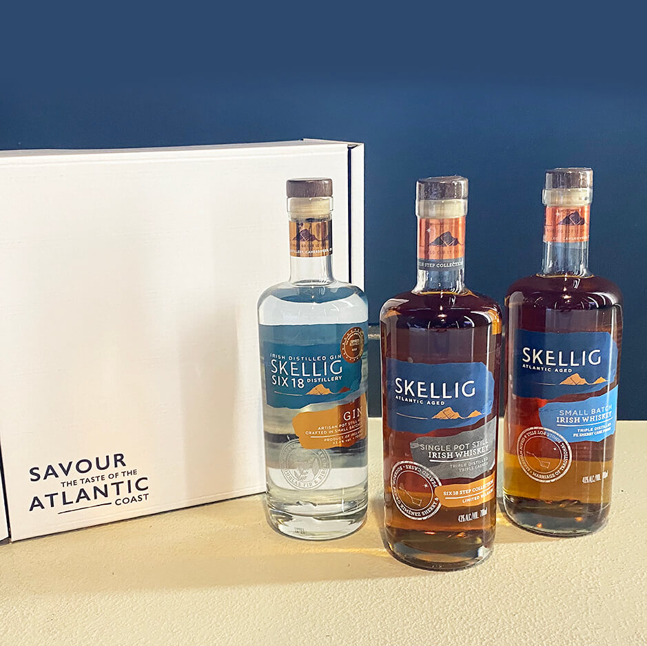 Three bottles next to a presentation box